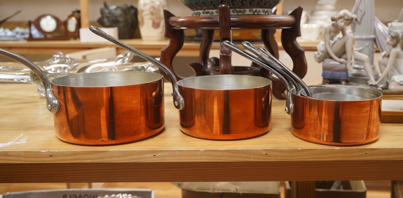 A set of five French graduated iron handled copper saucepans, largest 18.5cm diameter. Condition - good